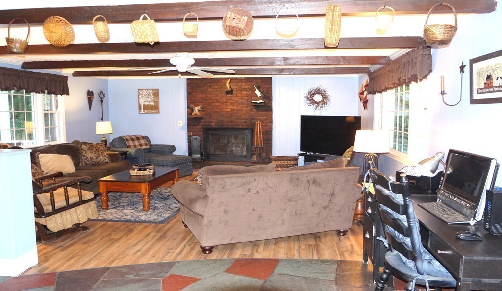 7 Pryor Road Natick, MA 01760 - Photo 10 of 24 a living room with furniture and a flat screen tv