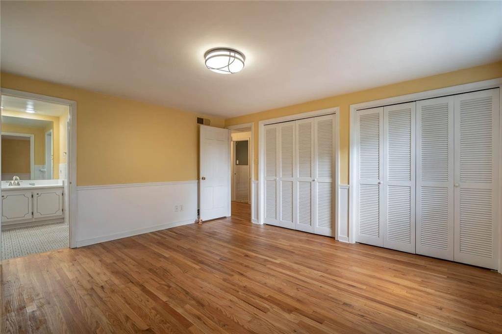 3326 Ponoka Road Pittsburgh, PA 15241 - Photo 14 of 25 wooden floor in an empty room with a window