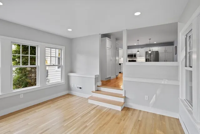 a view of entryway with wooden floor and electronic appliances