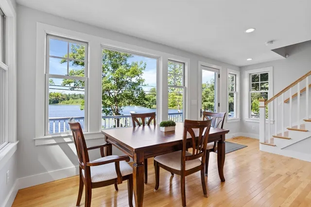 a dining room with furniture and wooden floor