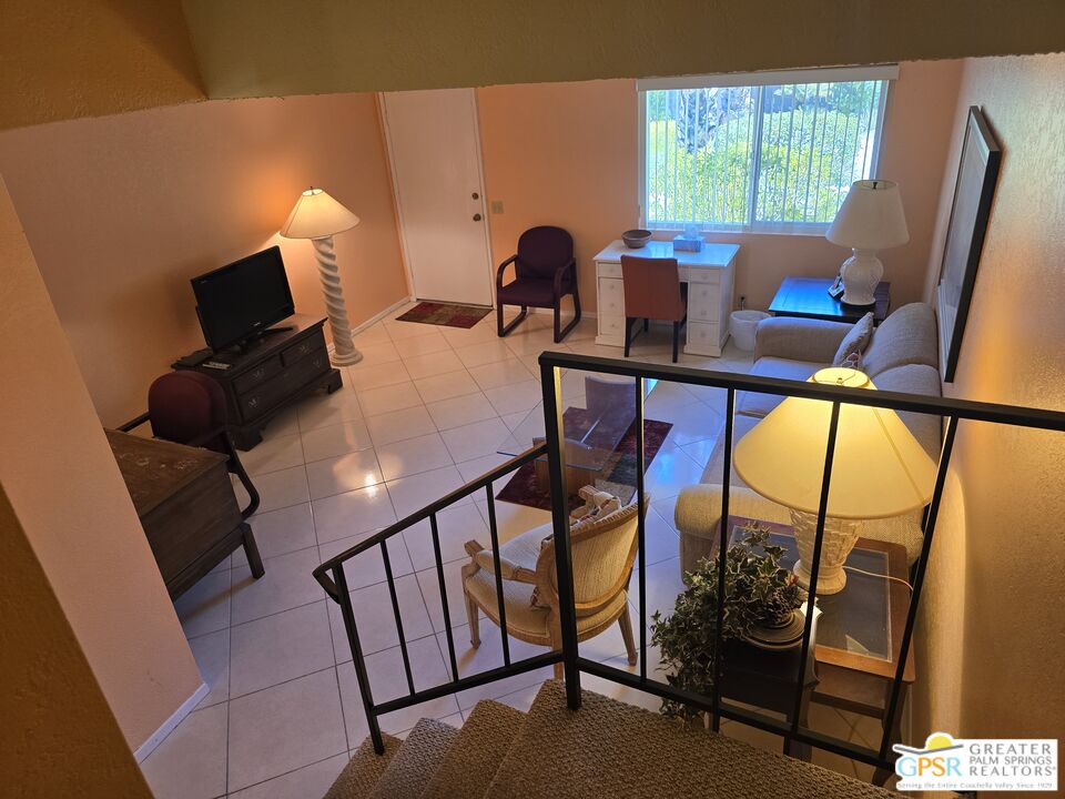 365 West Mariscal Road Palm Springs, CA 92262 - Photo 11 of 25 a view of a workspace with furniture and a window