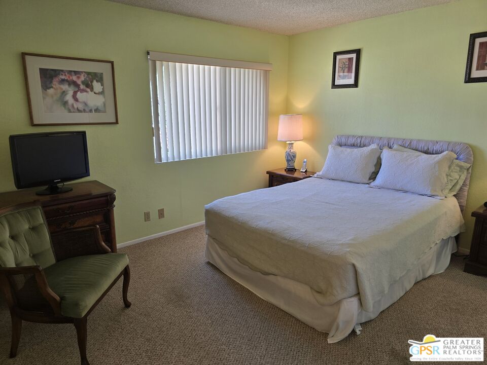 365 West Mariscal Road Palm Springs, CA 92262 - Photo 13 of 25 a bedroom with a bed and window