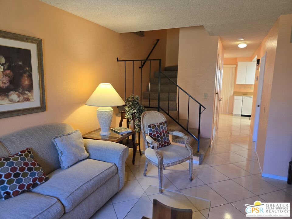 365 West Mariscal Road Palm Springs, CA 92262 - Photo 2 of 25 a living room with furniture and a painting