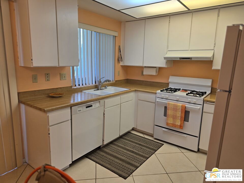 365 West Mariscal Road Palm Springs, CA 92262 - Photo 5 of 25 a kitchen with cabinets appliances and a sink