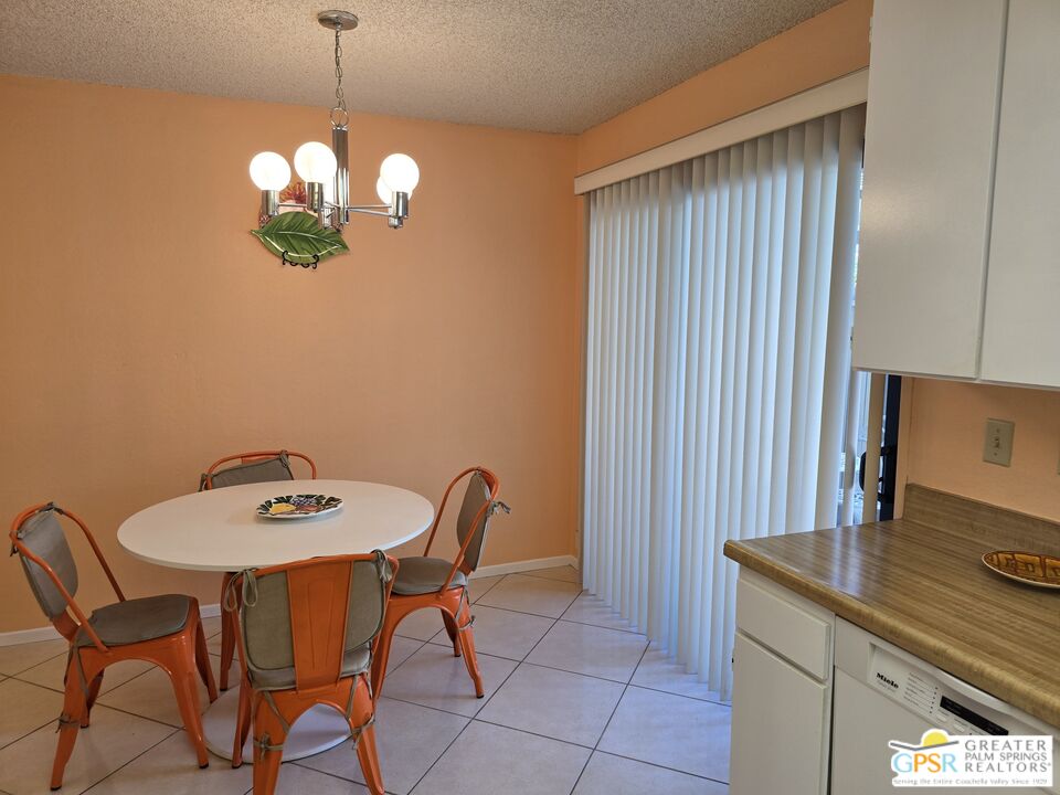 365 West Mariscal Road Palm Springs, CA 92262 - Photo 6 of 25 a view of a dining room with furniture and chandelier