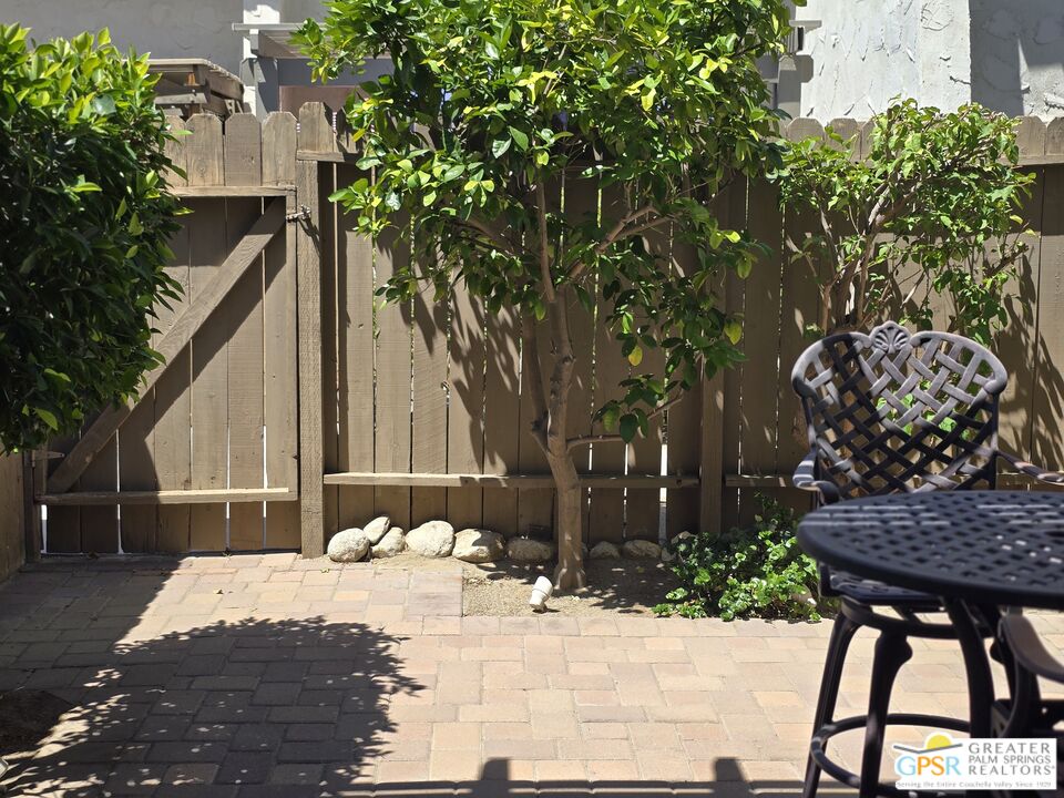 365 West Mariscal Road Palm Springs, CA 92262 - Photo 8 of 25 a view of a patio with table and chairs and potted plants