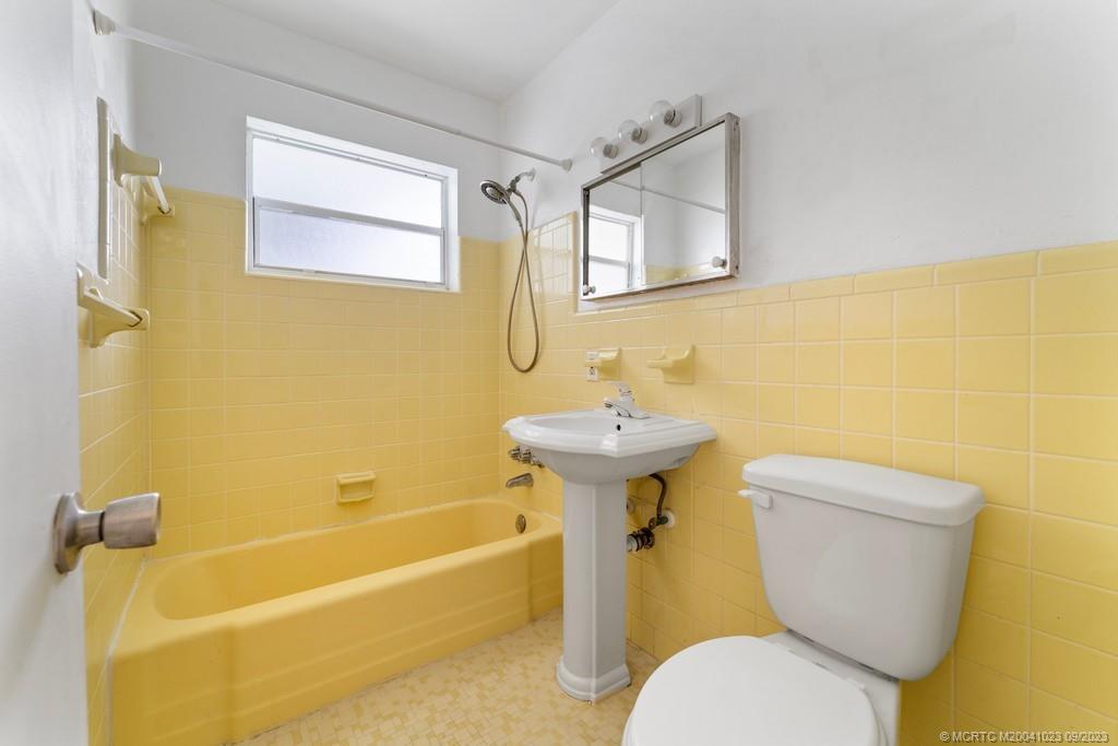 2825 Southeast Pocatella Road Port St. Lucie, FL 34952 - Photo 15 of 36 a bathroom with a sink and toilet