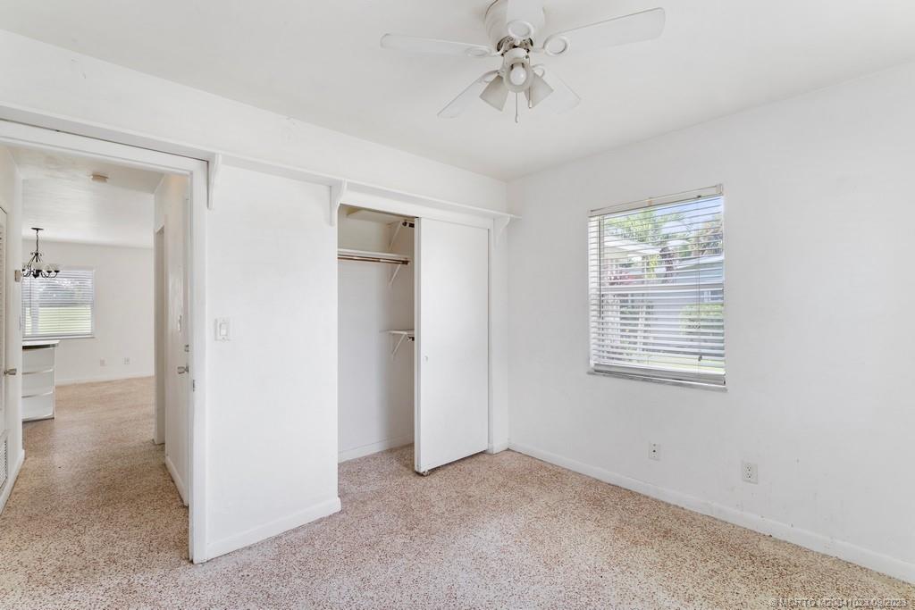 2825 Southeast Pocatella Road Port St. Lucie, FL 34952 - Photo 16 of 36 a view of an empty room with a window