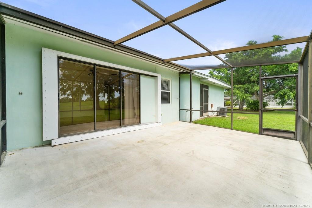 2825 Southeast Pocatella Road Port St. Lucie, FL 34952 - Photo 20 of 36 a view of an house with backyard and porch
