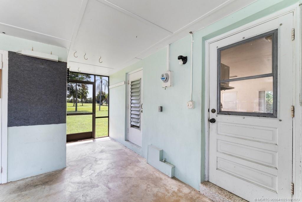 2825 Southeast Pocatella Road Port St. Lucie, FL 34952 - Photo 26 of 36 a view of an entryway with wooden floor