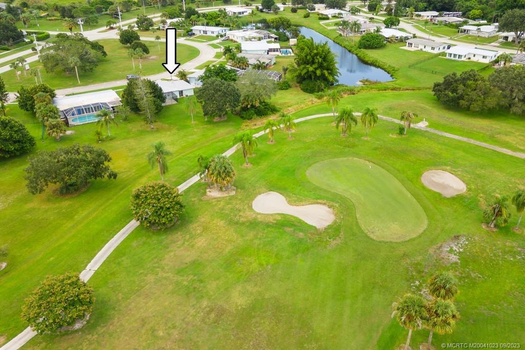 2825 Southeast Pocatella Road Port St. Lucie, FL 34952 - Photo 28 of 36 a view of a golf course with a yard