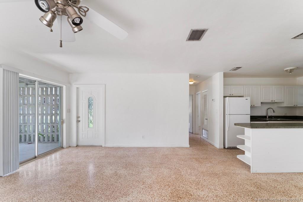 2825 Southeast Pocatella Road Port St. Lucie, FL 34952 - Photo 9 of 36 a view of a kitchen with a sink