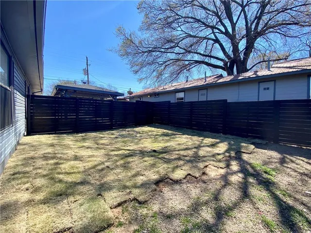 a view of a backyard of the house