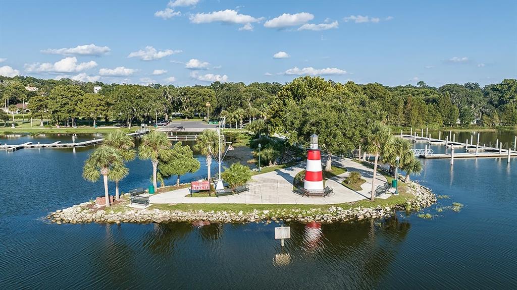 690 Gladstone Way Mount Dora, FL 32757 - Photo 25 of 25 a view of a lake with a house