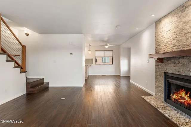 a kitchen with stainless steel appliances granite countertop a stove microwave and sink