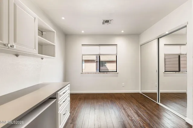a view of a livingroom with wooden floor
