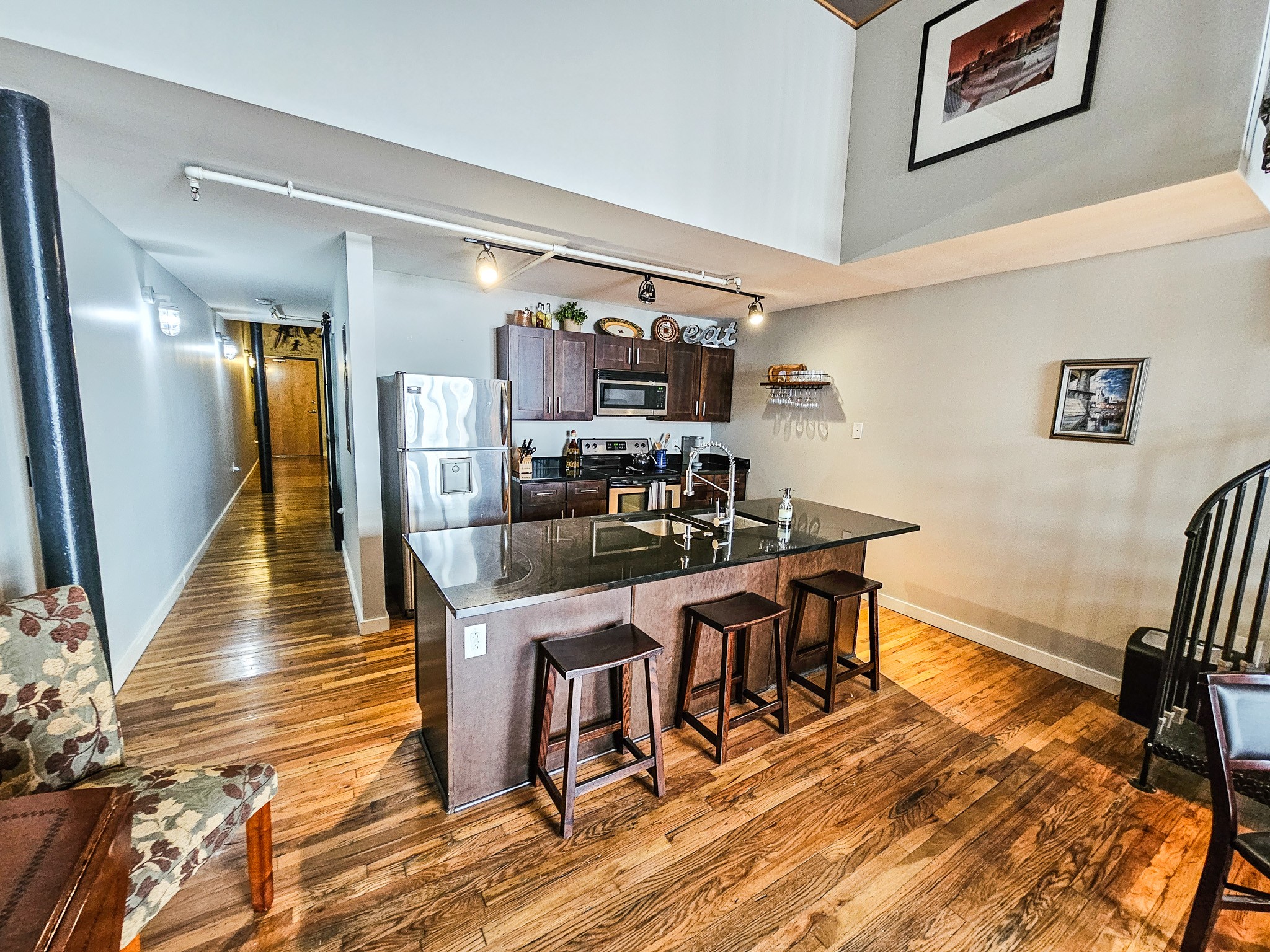 231 Rep. John Lewis Way North, Unit 406 Nashville, TN 37219 - Photo 12 of 30 a view of a dining room with furniture and wooden floor