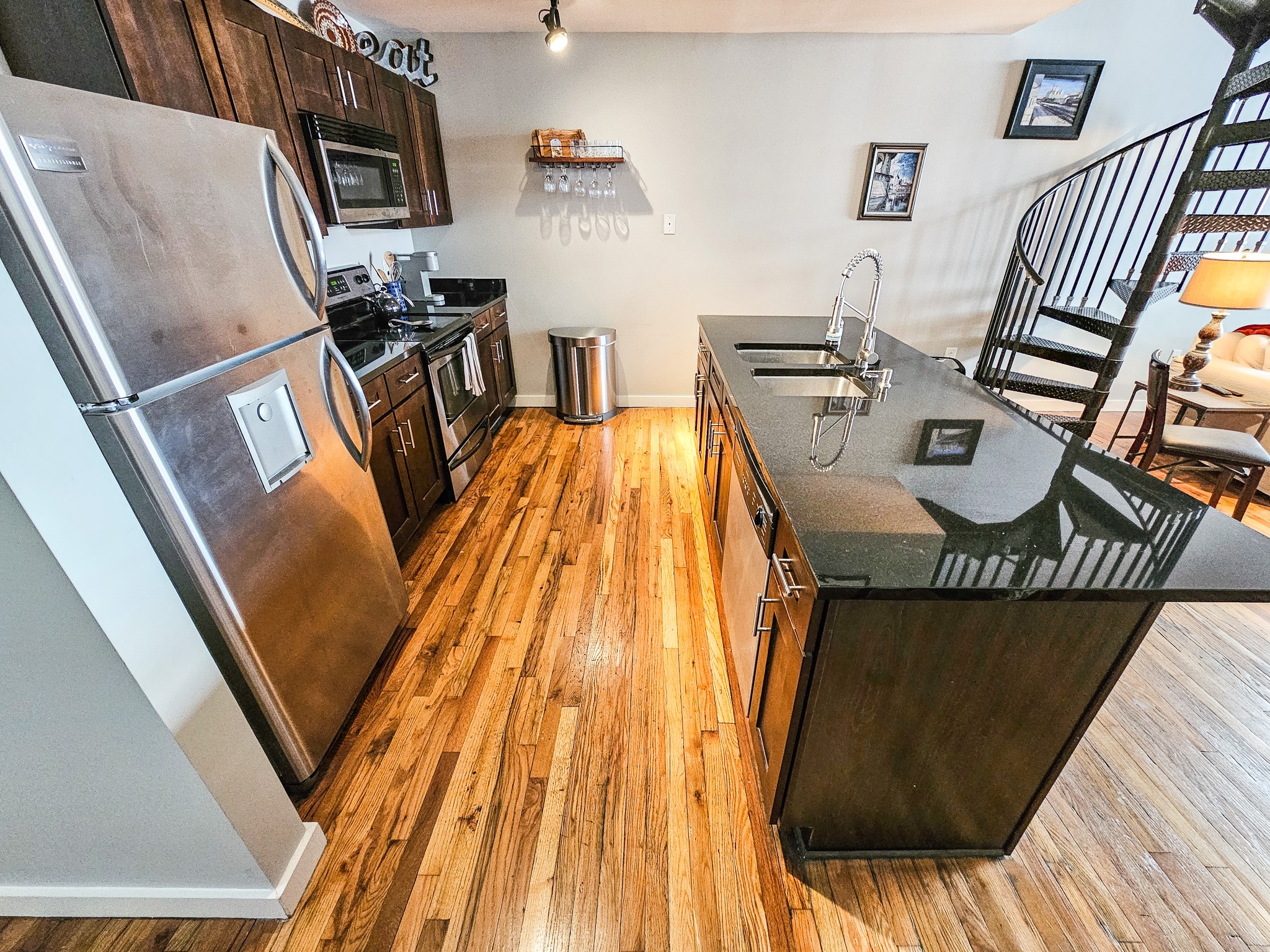231 Rep. John Lewis Way North, Unit 406 Nashville, TN 37219 - Photo 13 of 30 a view of kitchen and dining room with wooden floor