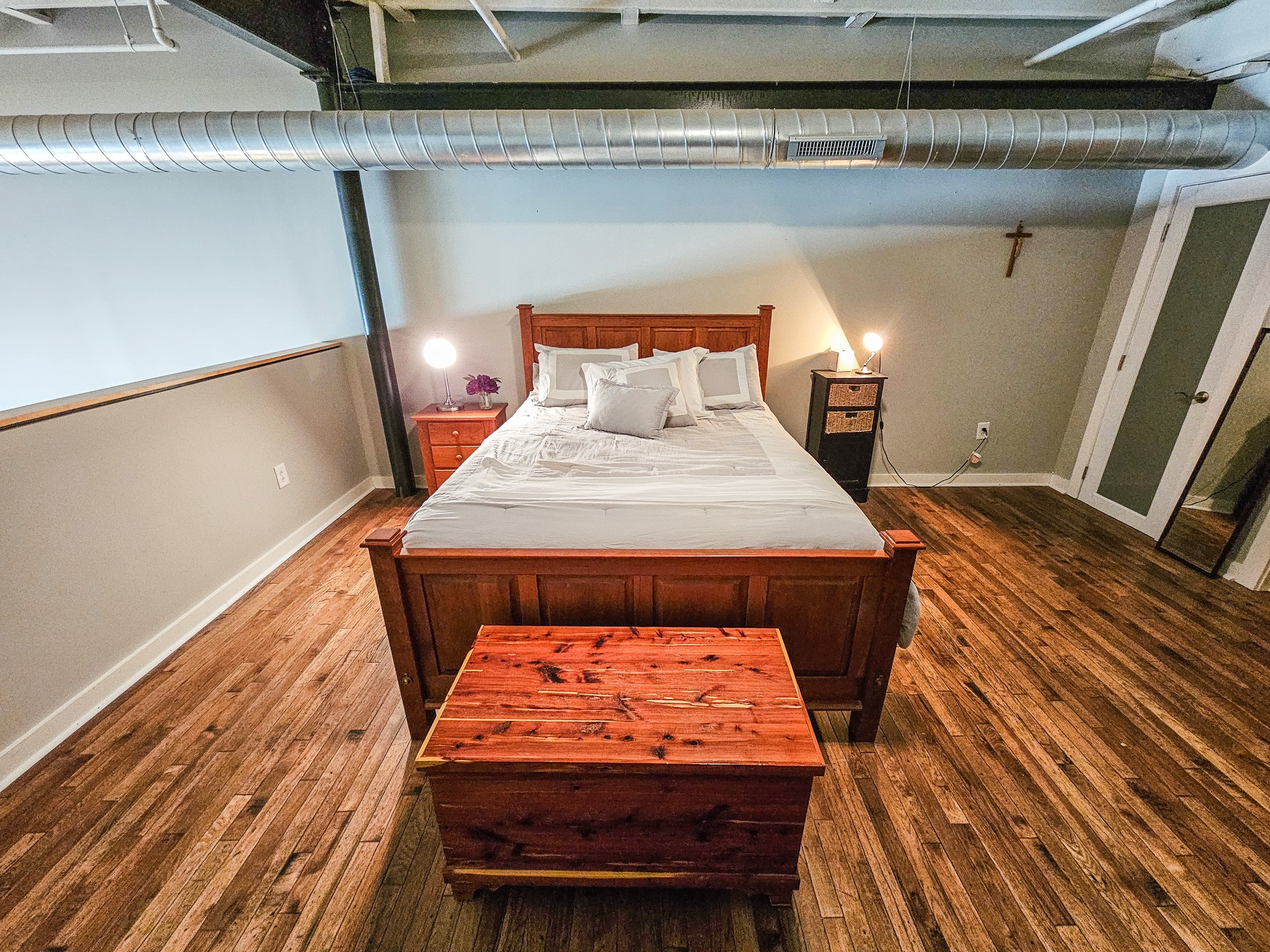 231 Rep. John Lewis Way North, Unit 406 Nashville, TN 37219 - Photo 20 of 30 a bed sitting in a bedroom next to a larger window