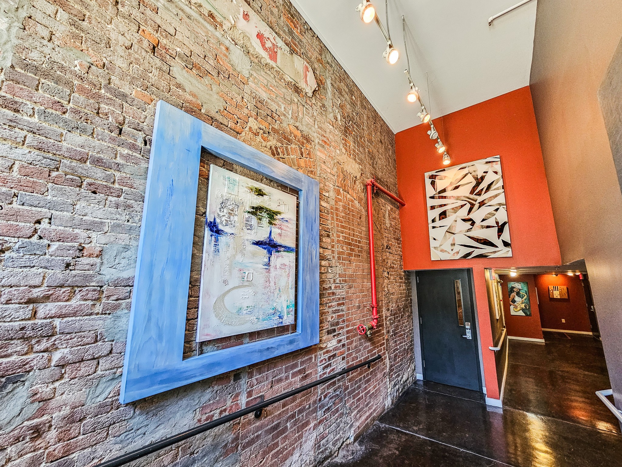 231 Rep. John Lewis Way North, Unit 406 Nashville, TN 37219 - Photo 2 of 30 a view of a hallway with wooden floor