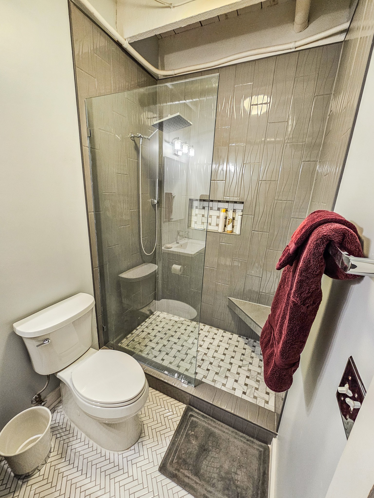 231 Rep. John Lewis Way North, Unit 406 Nashville, TN 37219 - Photo 24 of 30 a bathroom with a sink toilet and shower