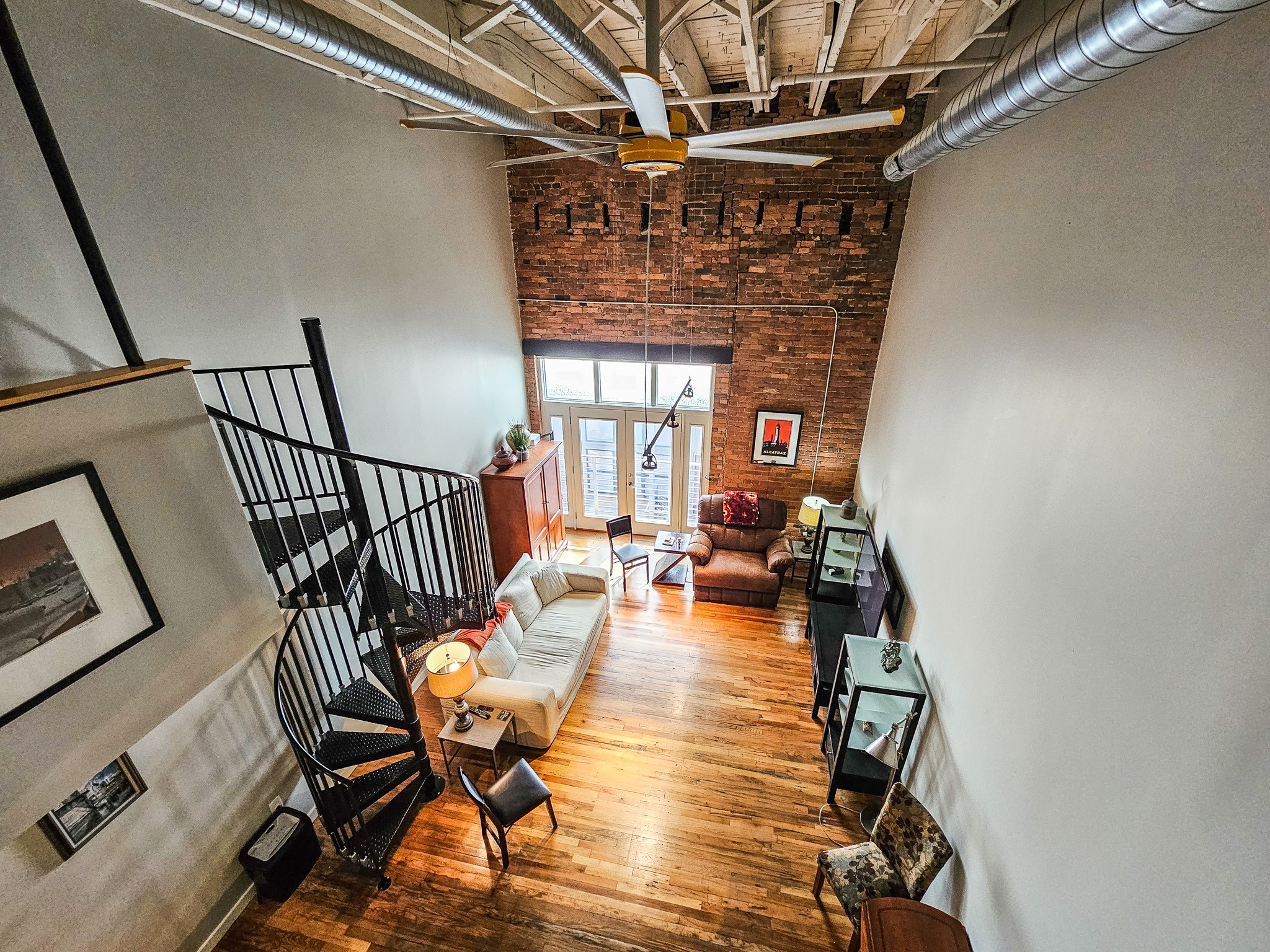 231 Rep. John Lewis Way North, Unit 406 Nashville, TN 37219 - Photo 25 of 30 a view of a livingroom with furniture and wooden floor