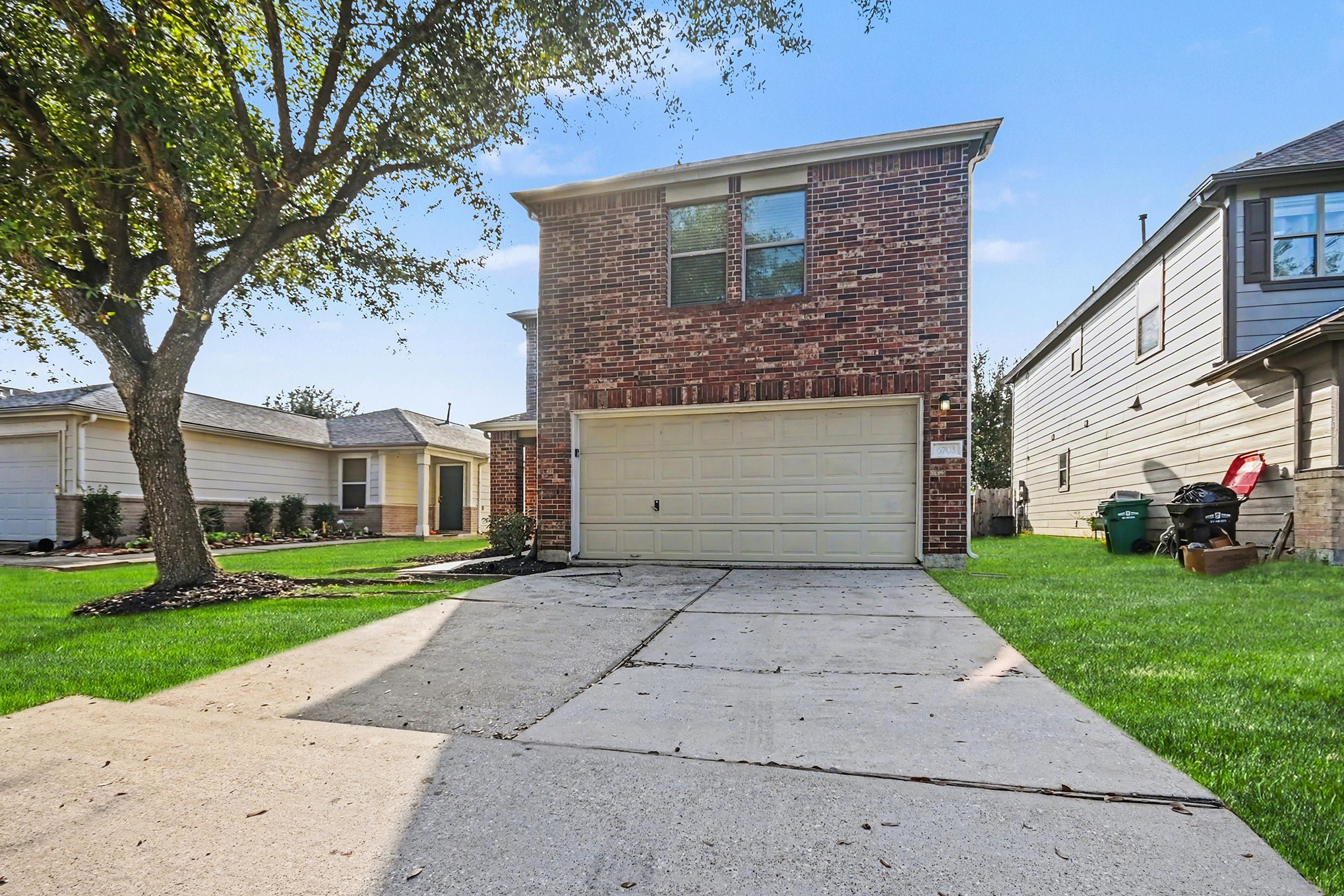 6703 Providence View Lane Houston, TX 77049 - Photo 14 of 21 a front view of a house with a yard