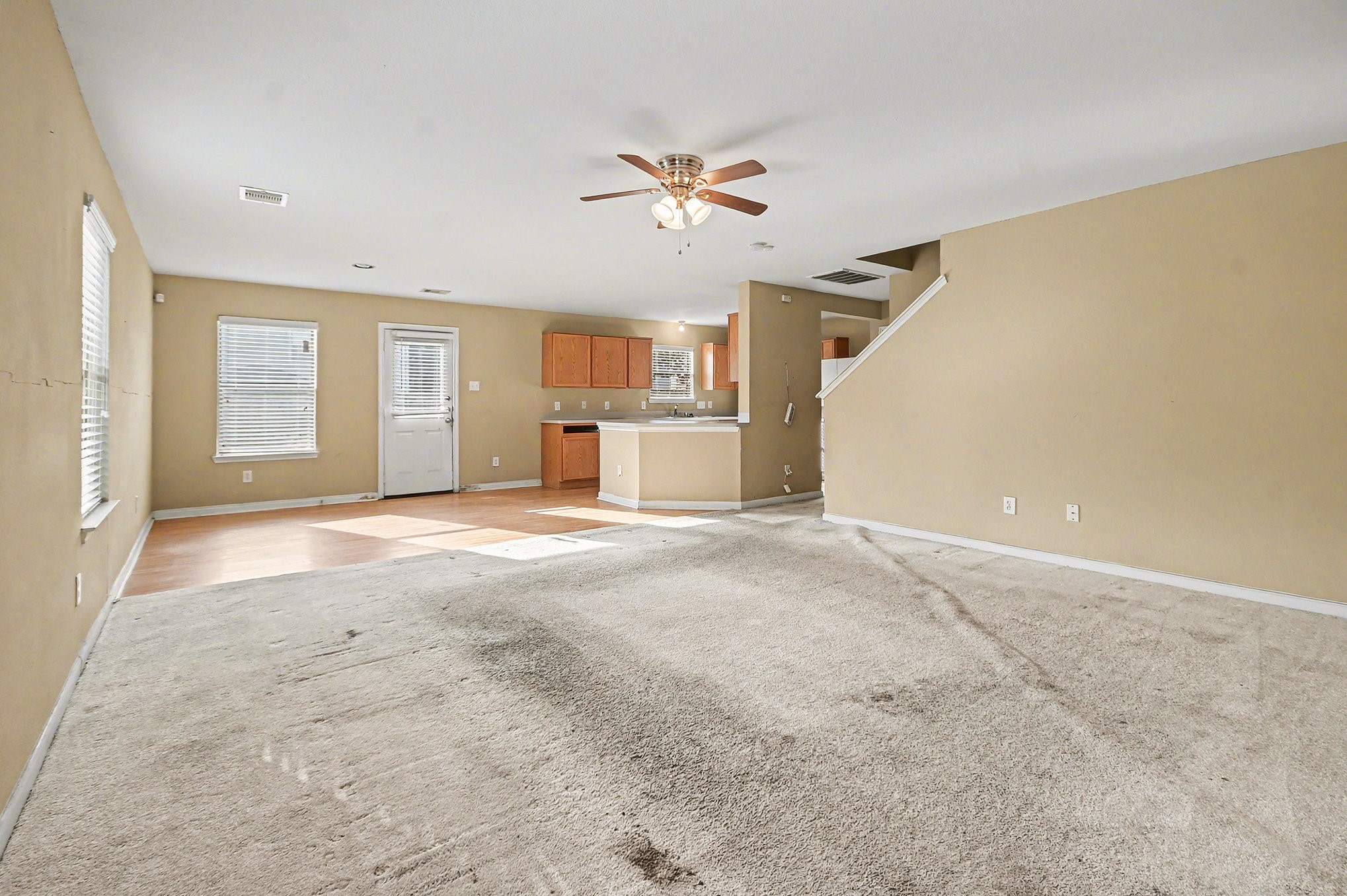 6703 Providence View Lane Houston, TX 77049 - Photo 2 of 21 a view of a livingroom with a ceiling fan and window