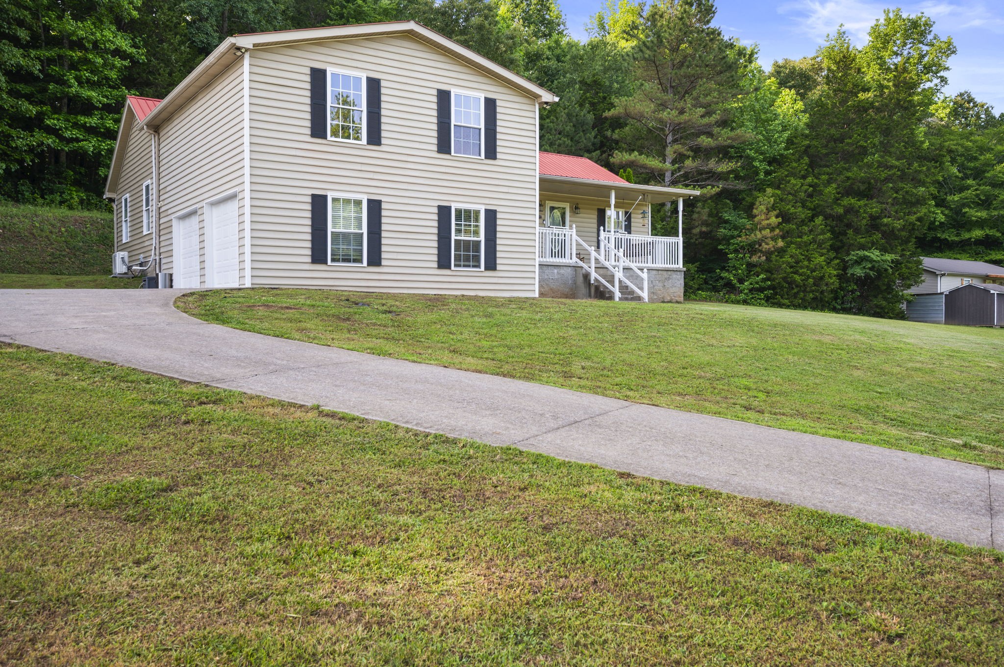 1197 Biter Road Cunningham, TN 37052 - Photo 31 of 38 a front view of a house with a garden