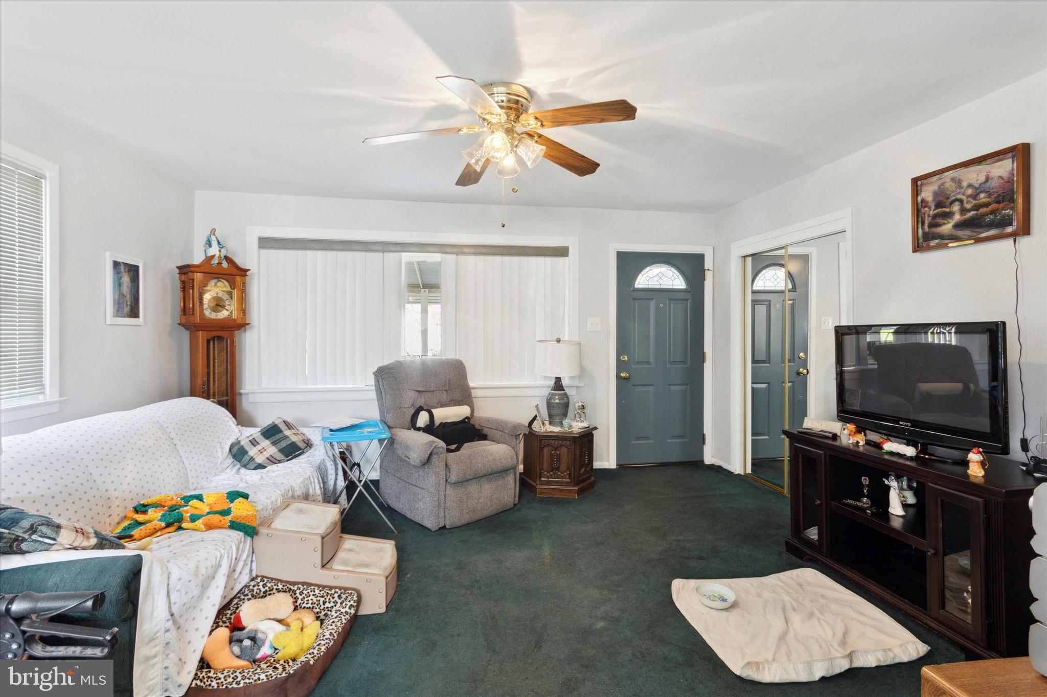 602 Wynnbrook Road Secane, PA 19018 - Photo 4 of 16 a living room with furniture and a flat screen tv