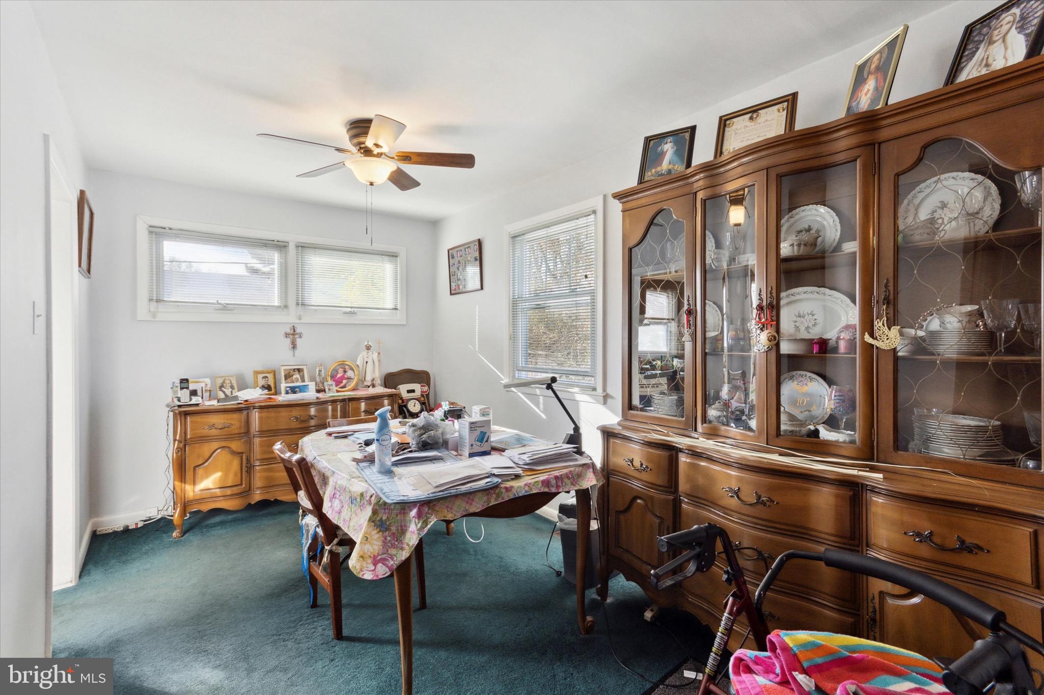 602 Wynnbrook Road Secane, PA 19018 - Photo 5 of 16 a room with chandelier fan and windows