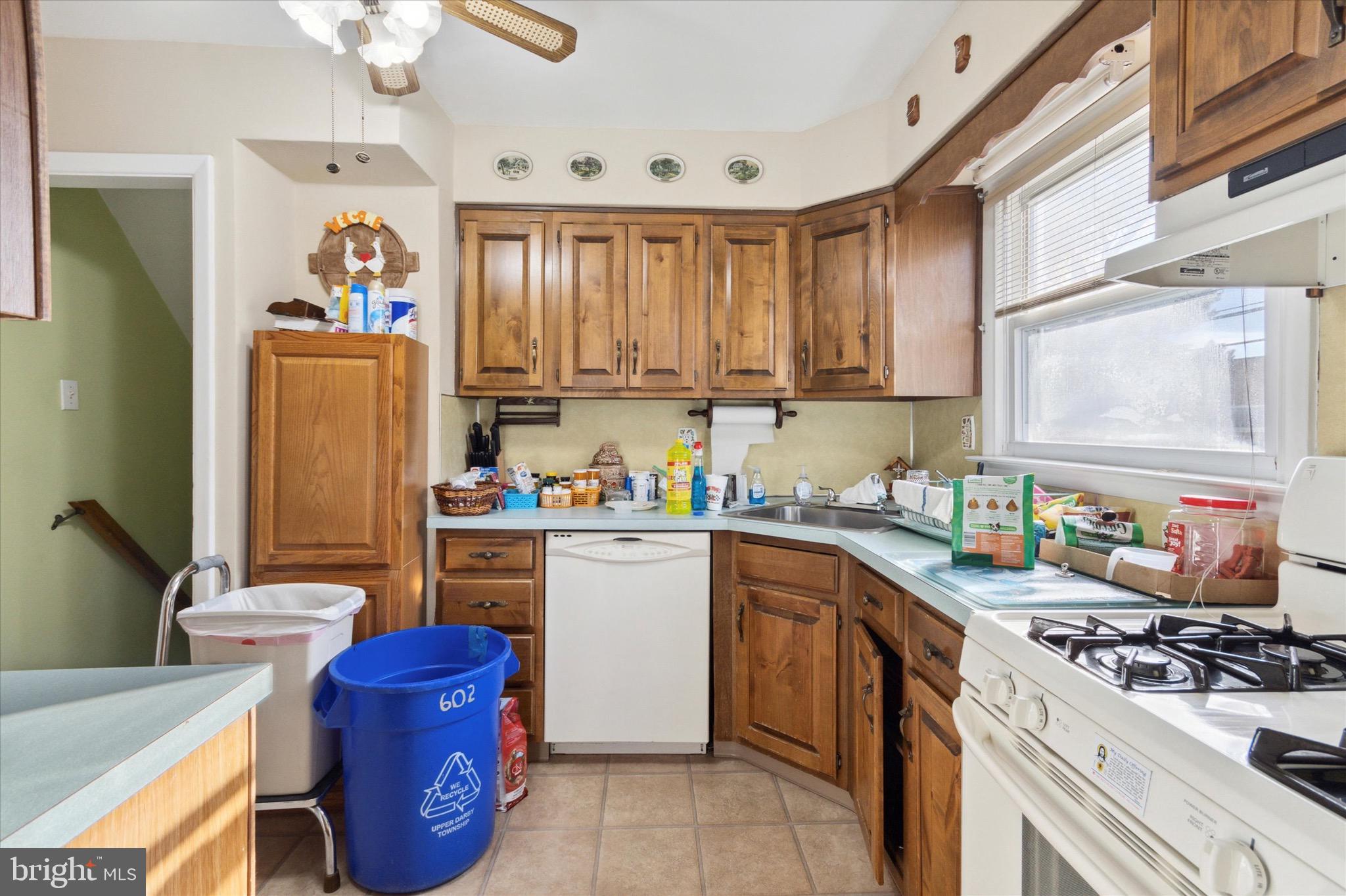 602 Wynnbrook Road Secane, PA 19018 - Photo 6 of 16 a kitchen with a sink stove and refrigerator