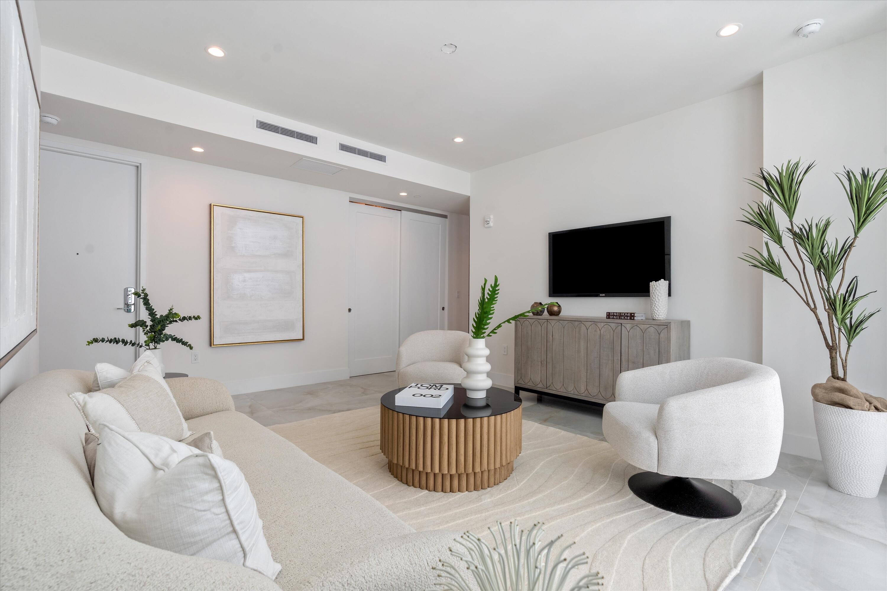 485 East Royal Palm Road, Unit 804 Boca Raton, FL 33432 - Photo 20 of 50 a living room with furniture and a flat screen tv