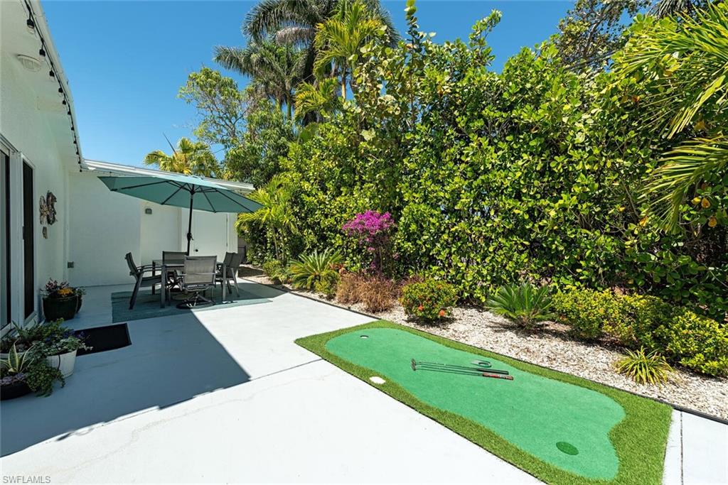 1971 Holiday Lane Naples, FL 34104 - Photo 12 of 26 a view of a backyard
