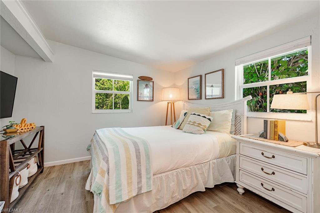 1971 Holiday Lane Naples, FL 34104 - Photo 14 of 26 a bedroom with a bed and a window