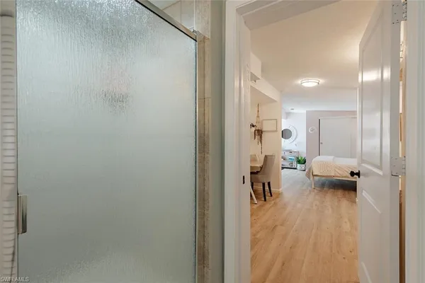 a view of a hallway with seating area
