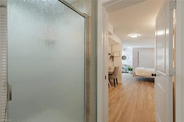 a view of a hallway with seating area