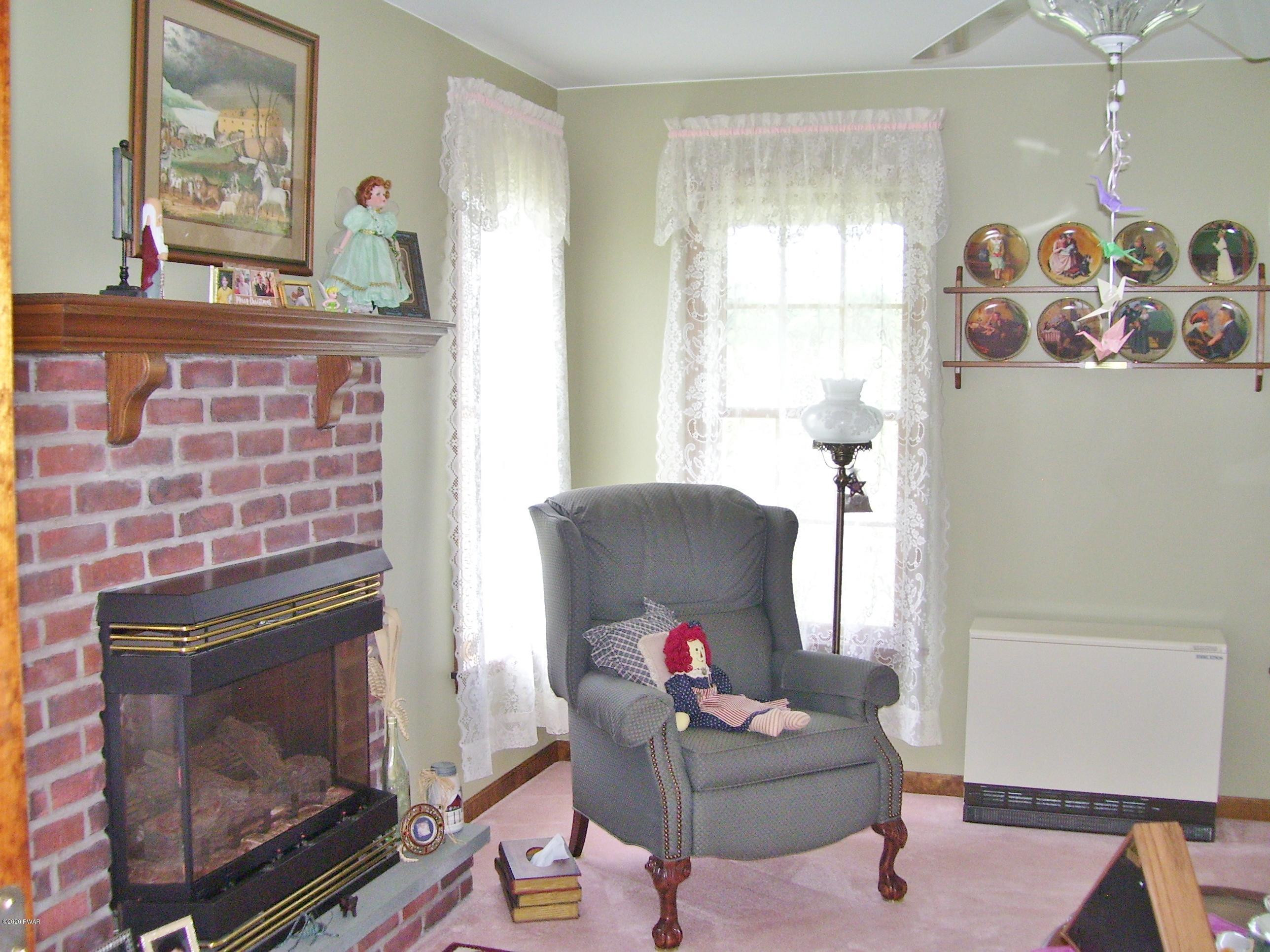 50 Layton Road Waymart, PA 18472 - Photo 7 of 61 a living room with furniture and a fireplace
