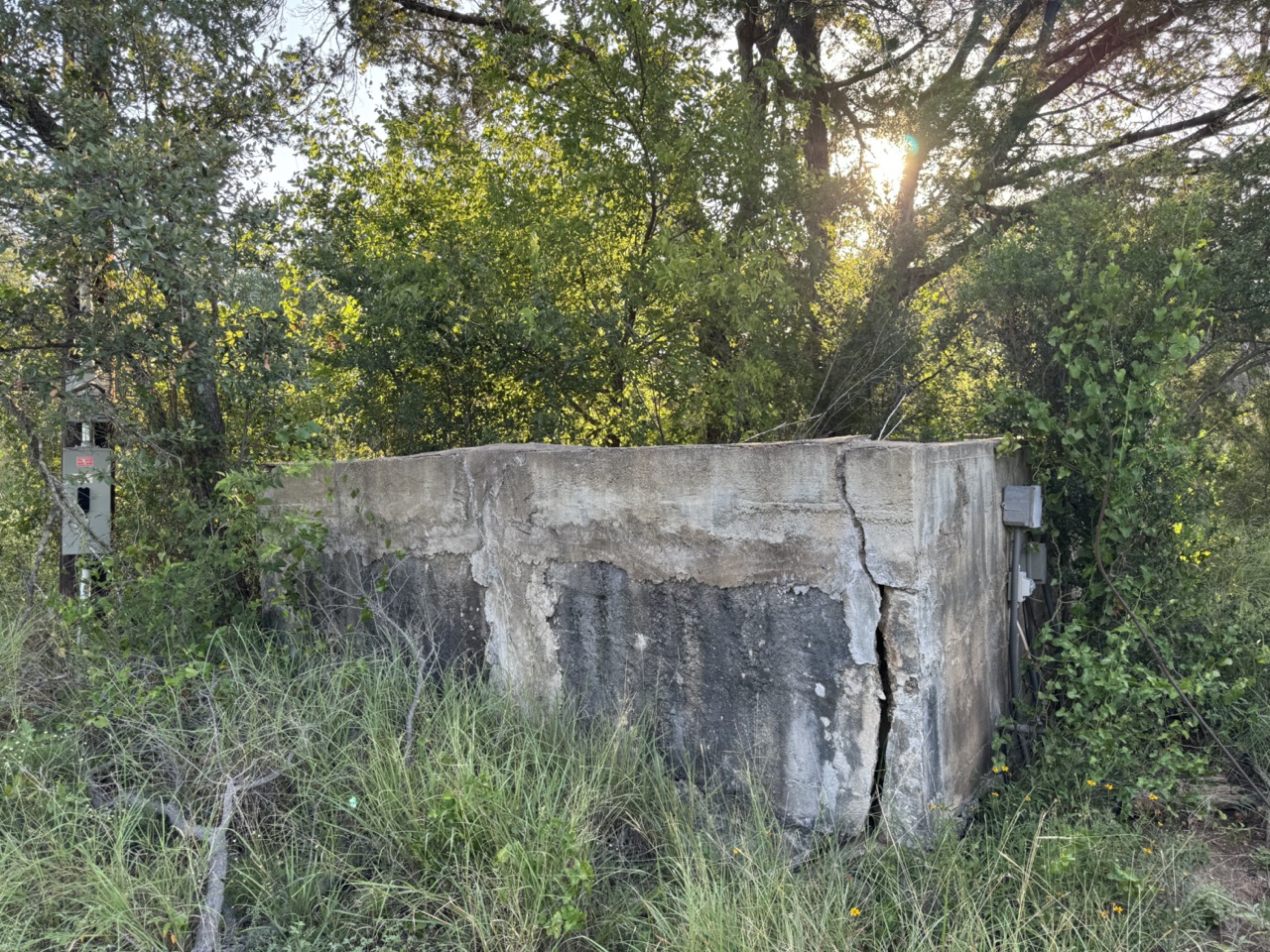 25723 Hamilton Pool Road Round Mountain, TX 78663 - Photo 8 of 32 Old cistern at the front of the property
