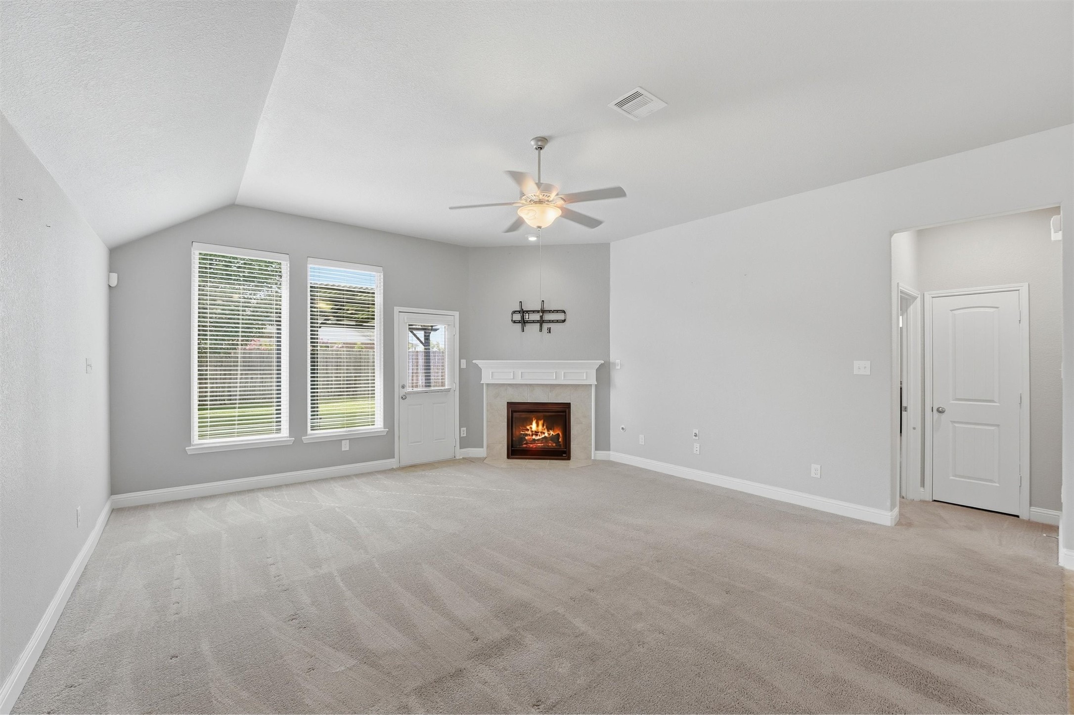 1911 Cedar Ridge Lane Pearland, TX 77089 - Photo 15 of 33 Spacious living room with gas log fireplace and high ceilings - *fireplace virtually lit*