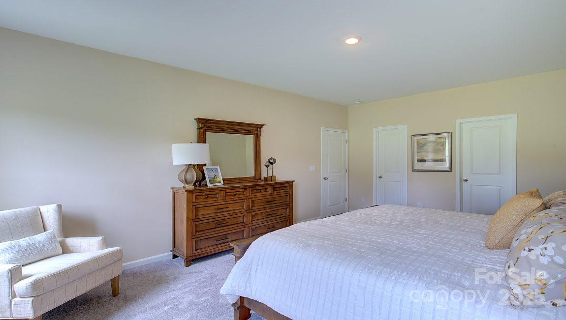 145 Bovine Br Road Fletcher, NC 28732 - Photo 16 of 43 a bedroom with a bed and furniture