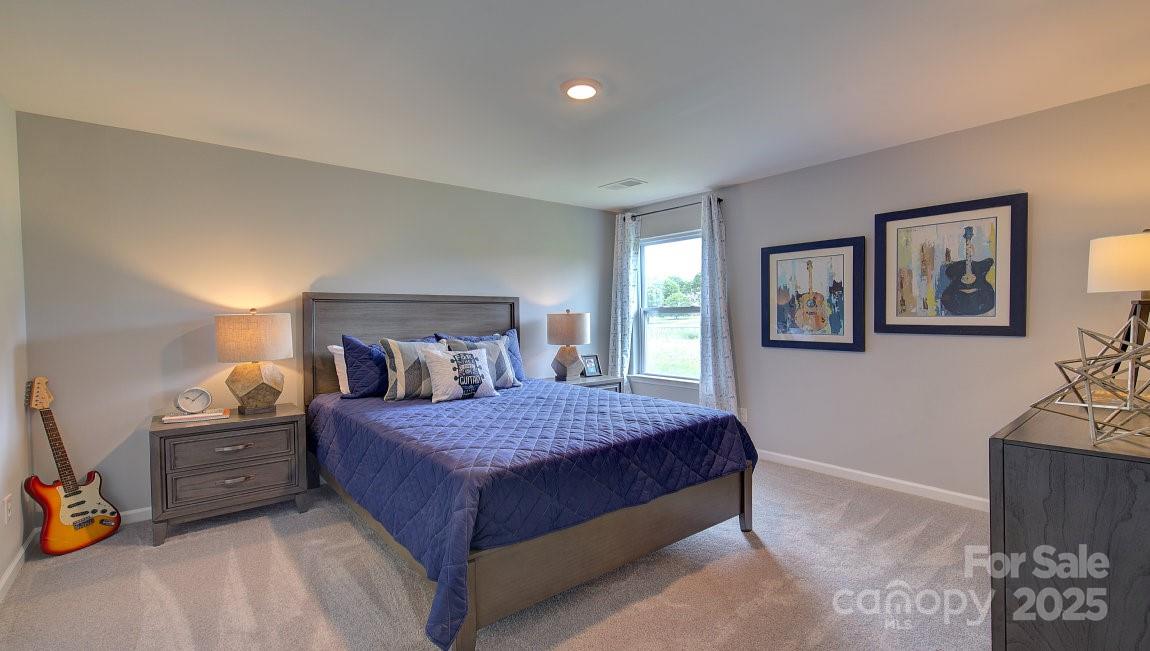 145 Bovine Br Road Fletcher, NC 28732 - Photo 22 of 43 a bedroom with a bed and a cabinets