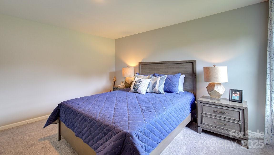 145 Bovine Br Road Fletcher, NC 28732 - Photo 23 of 43 a bedroom with a bed and a night stand