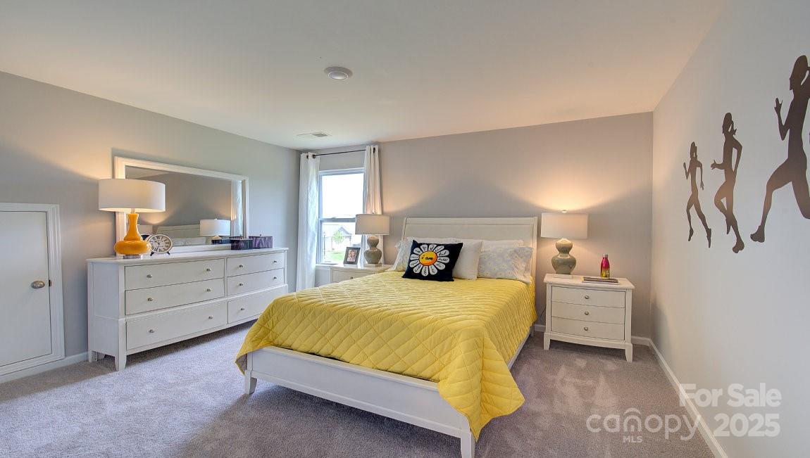 145 Bovine Br Road Fletcher, NC 28732 - Photo 24 of 43 a bedroom with a bed and a dresser
