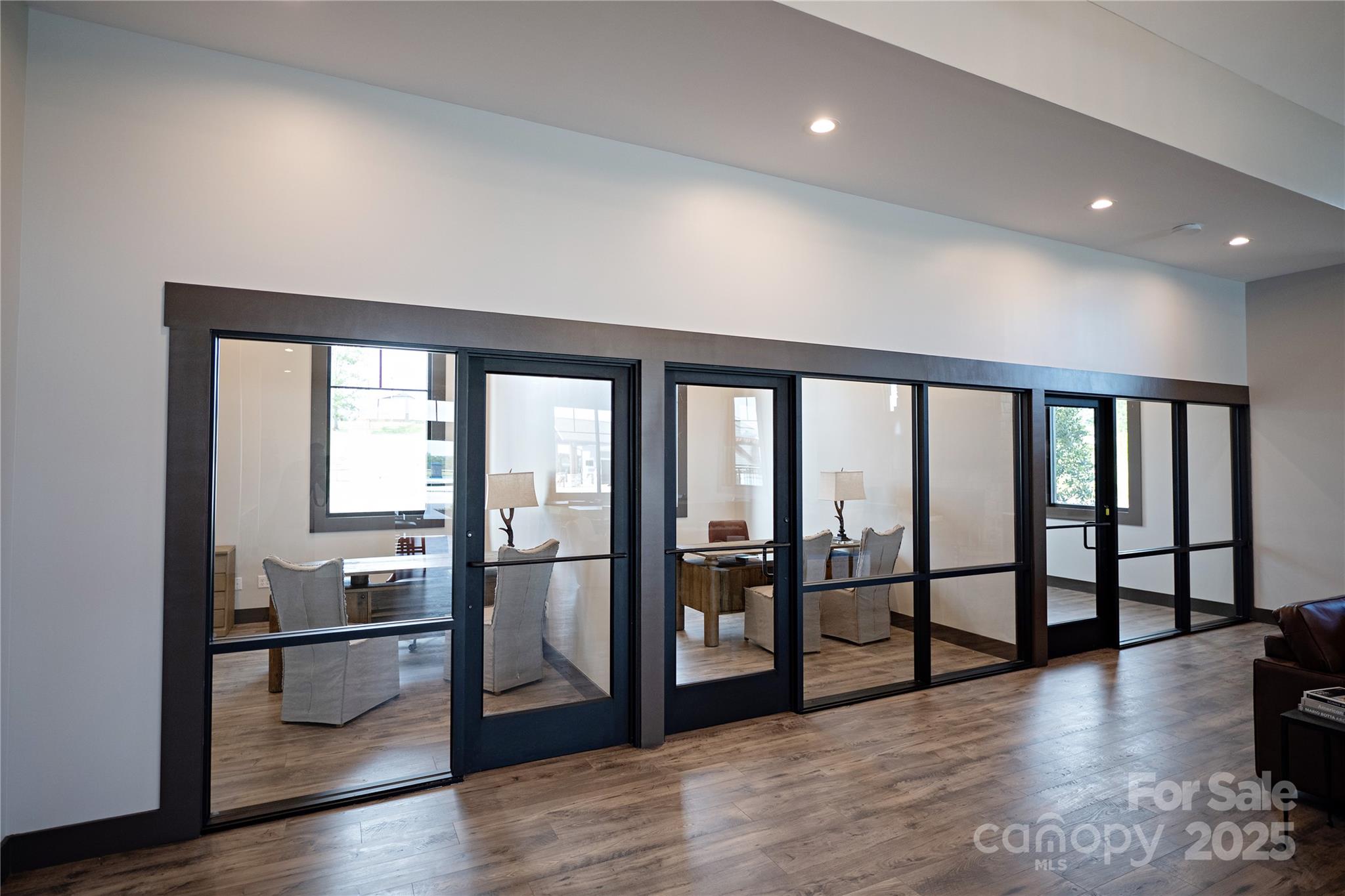 145 Bovine Br Road Fletcher, NC 28732 - Photo 40 of 43 a view of a big room with wooden floor and windows
