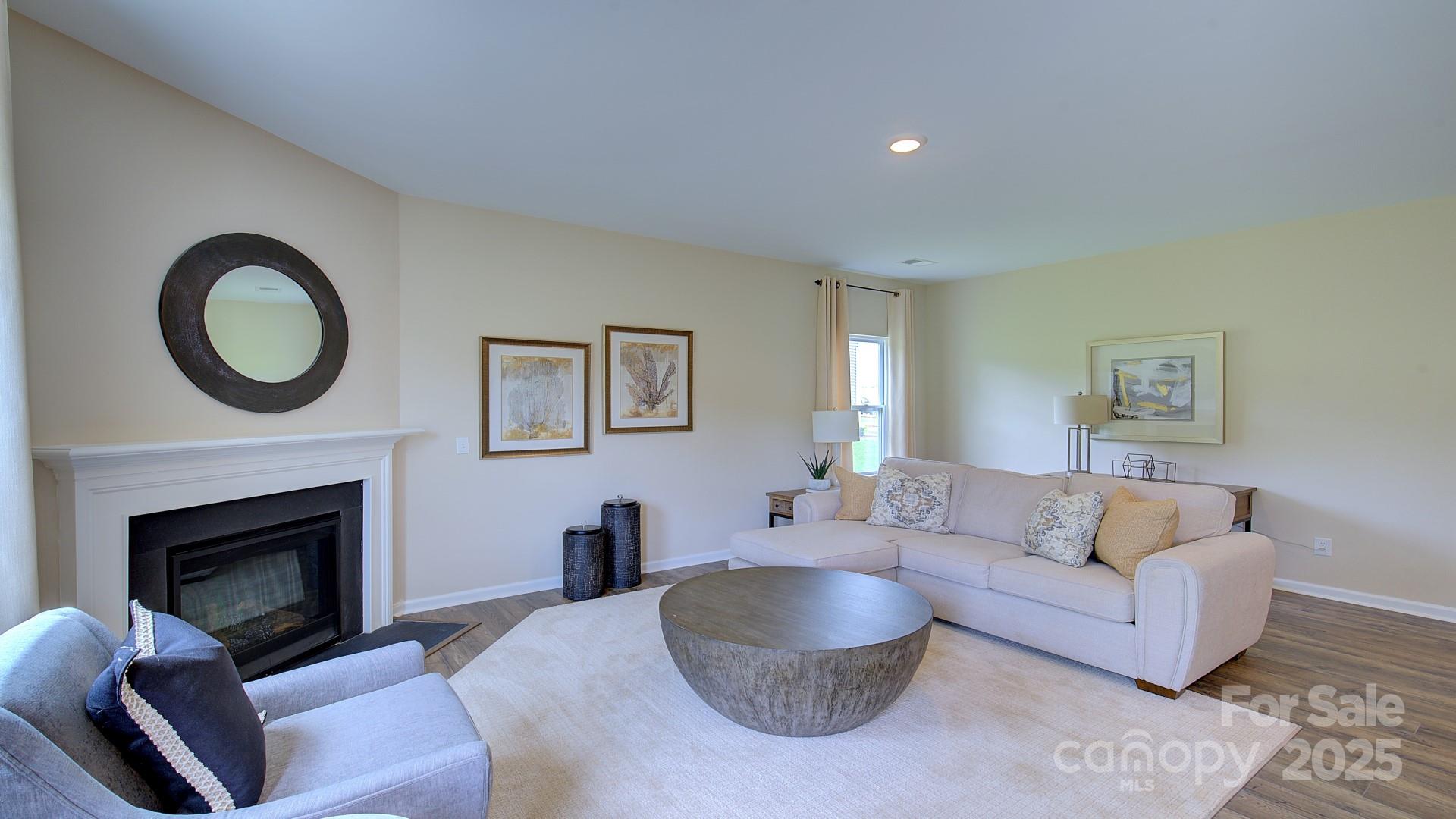145 Bovine Br Road Fletcher, NC 28732 - Photo 8 of 43 a living room with furniture a rug a fireplace and a window