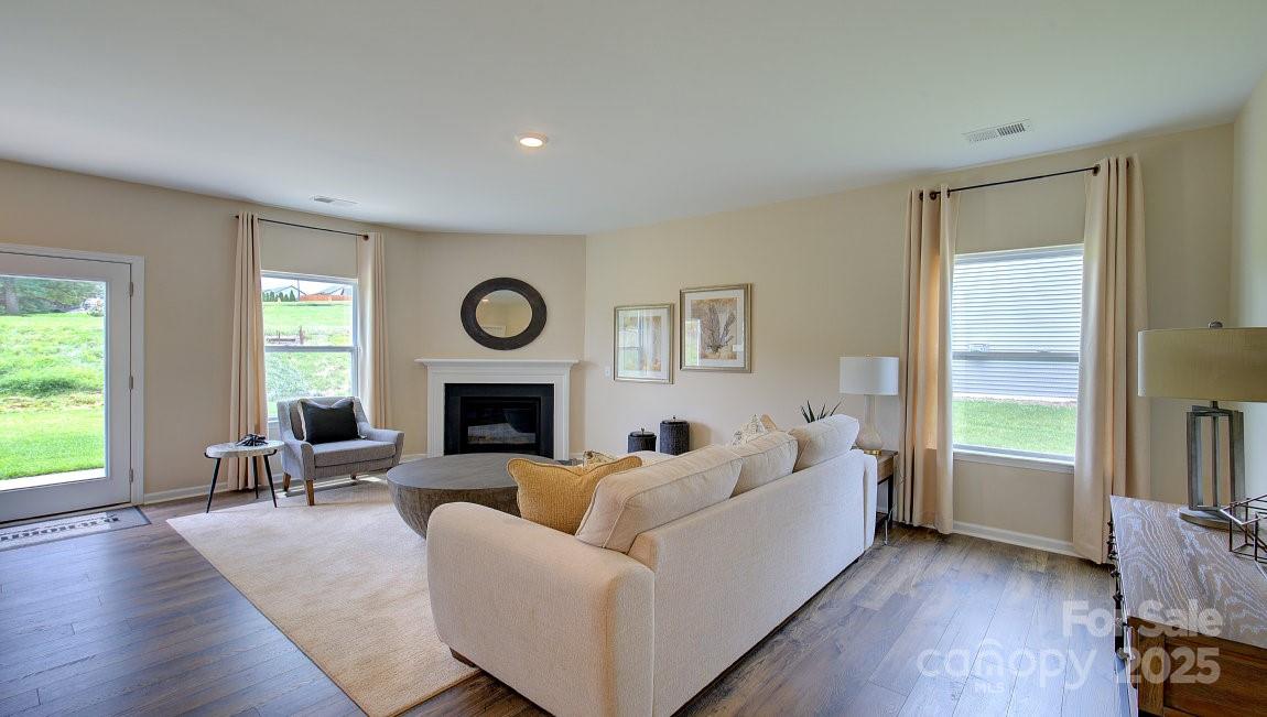 145 Bovine Br Road Fletcher, NC 28732 - Photo 10 of 43 a living room with furniture and a fireplace