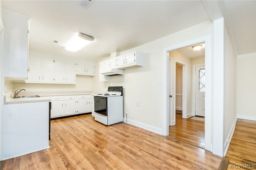 9604 Meadowview Road Richmond, VA 23294 - Photo 8 of 32 a view of a kitchen with wooden floor
