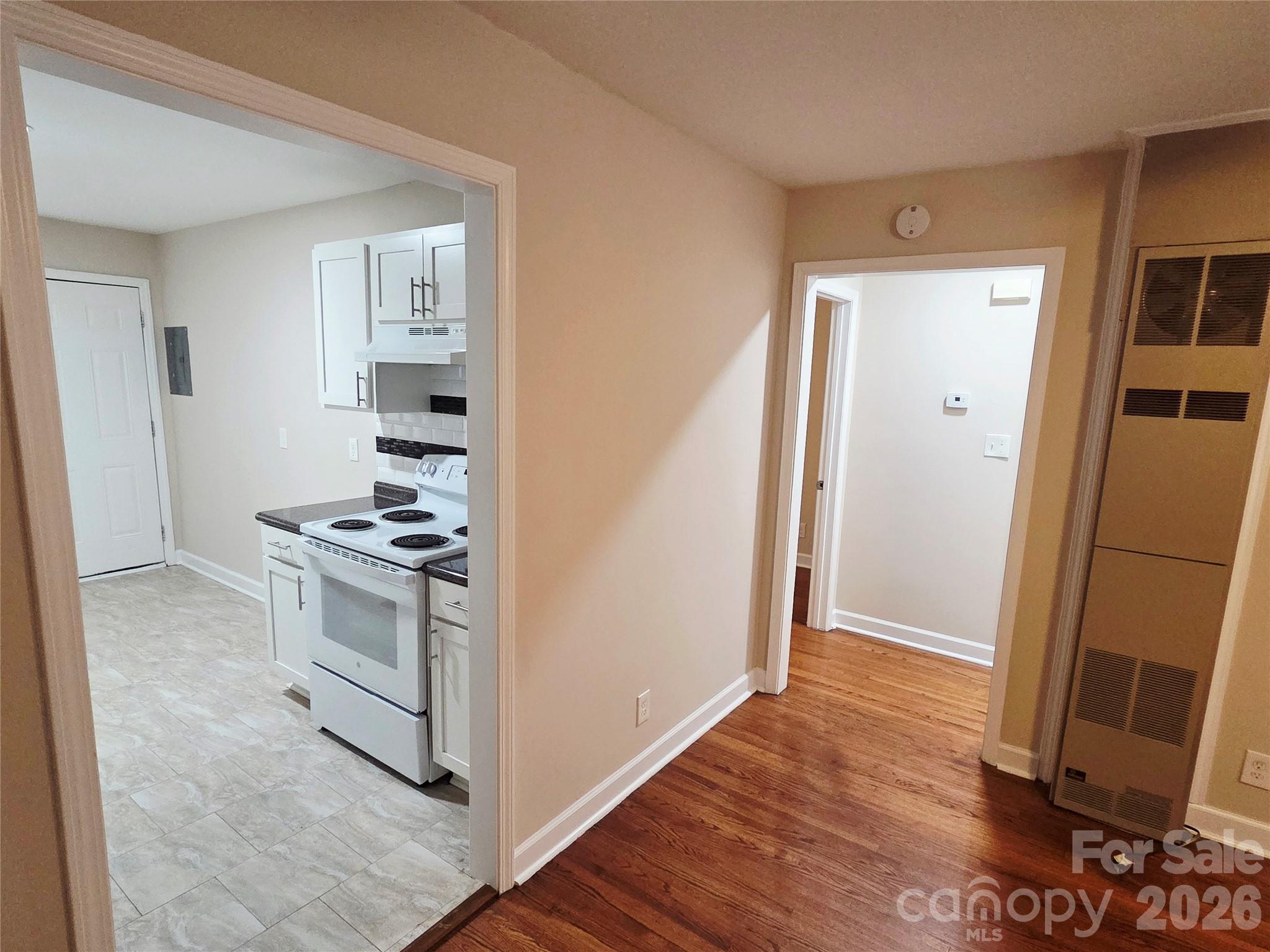 3500 North Sharon Amity Road Charlotte, NC 28212 - Photo 12 of 16 a view of kitchen and wooden floor