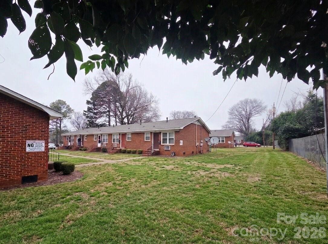 3500 North Sharon Amity Road Charlotte, NC 28212 - Photo 4 of 16 a view of a house with a big yard
